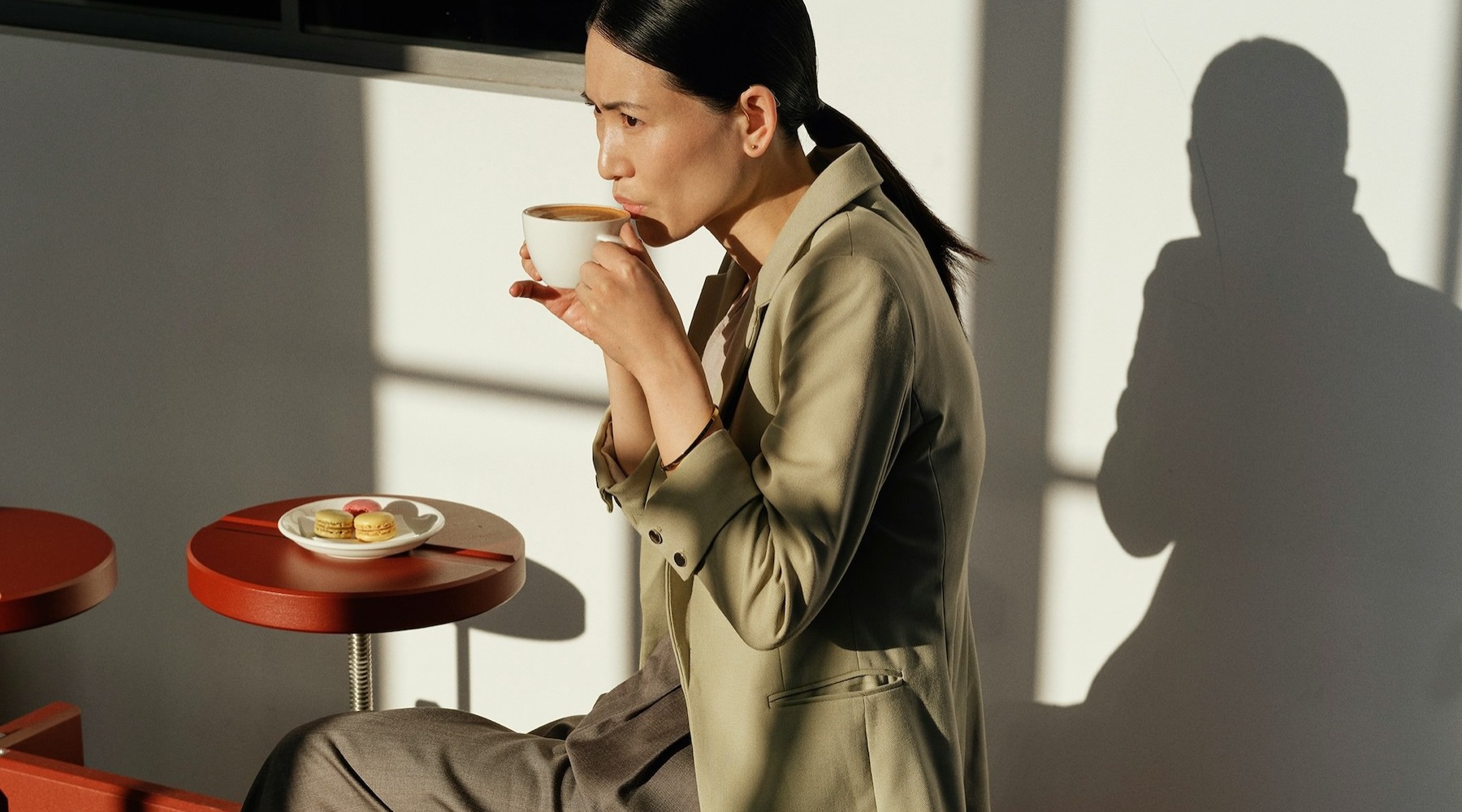 a woman sipping a drink